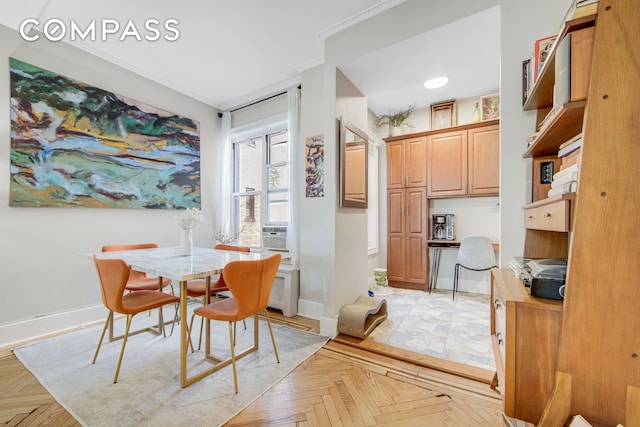 dining space featuring baseboards