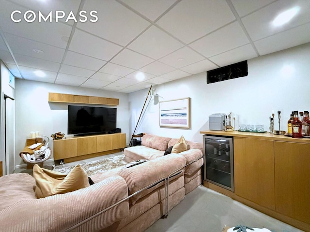 269 Ainslie St, New York City, NY 11211 - living room featuring wet bar, wine cooler, concrete flooring, and a paneled ceiling
