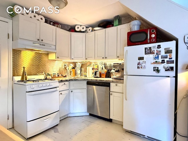 269 Ainslie St, New York City, NY 11211 - kitchen featuring decorative backsplash, under cabinet range hood, white appliances, and white cabinetry