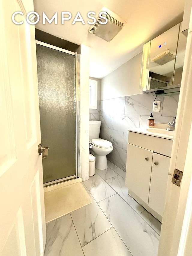 269 Ainslie St, New York City, NY 11211 - bathroom featuring vanity, marble finish floor, a stall shower, and toilet