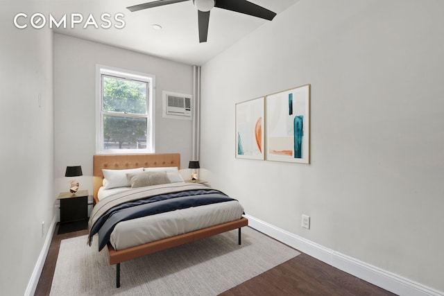 269 Ainslie St, New York City, NY 11211 - bedroom featuring a ceiling fan, baseboards, a wall unit AC, and wood finished floors