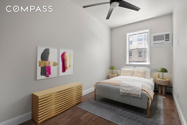269 Ainslie St, New York City, NY 11211 - bedroom featuring baseboards, a wall unit AC, a ceiling fan, and wood finished floors