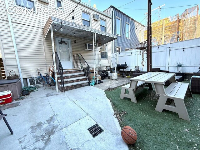 269 Ainslie St, New York City, NY 11211 - view of patio / terrace featuring fence, grilling area, and a wall mounted air conditioner