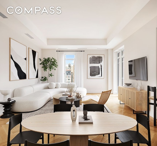 378 W End Ave Unit 11B, New York City, NY 10024 - living area featuring visible vents, a raised ceiling, and baseboards