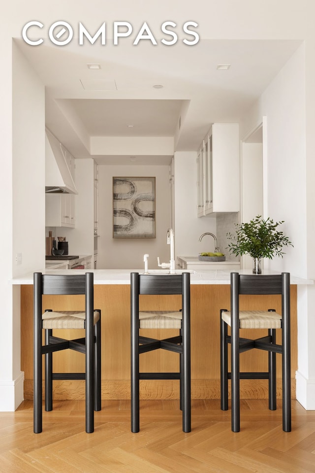 378 W End Ave Unit 11B, New York City, NY 10024 - bar with a tray ceiling and wall chimney exhaust hood