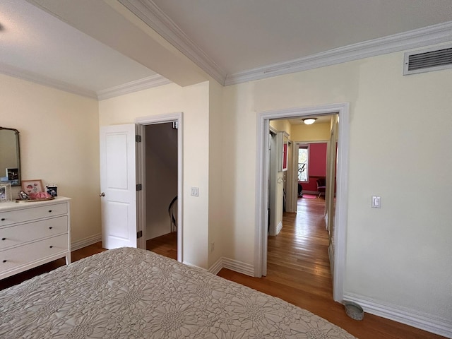 6 3rd St, New York City, NY 11231 - bedroom featuring crown molding, baseboards, visible vents, and wood finished floors