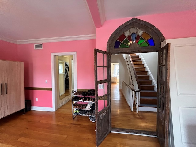 6 3rd St, New York City, NY 11231 - stairs with visible vents, baseboards, crown molding, and wood finished floors