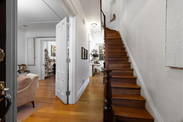 6 3rd St, New York City, NY 11231 - stairway featuring baseboards, visible vents, ornamental molding, and wood finished floors