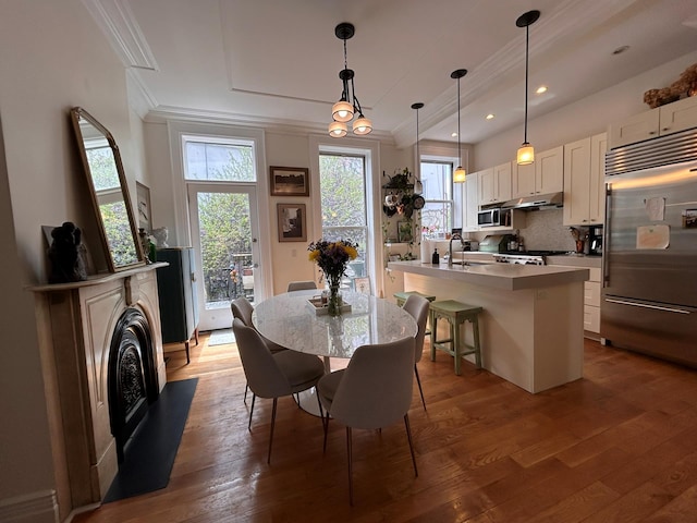 6 3rd St, New York City, NY 11231 - dining space with wood-type flooring, recessed lighting, and ornamental molding