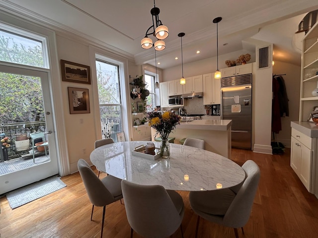 6 3rd St, New York City, NY 11231 - dining space featuring visible vents, wood finished floors, baseboards, ornamental molding, and recessed lighting