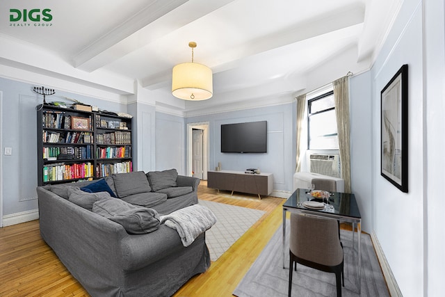 760 W End Ave Unit 1A, New York City, NY 10025 - living area with beamed ceiling, wood finished floors, cooling unit, ornamental molding, and baseboards