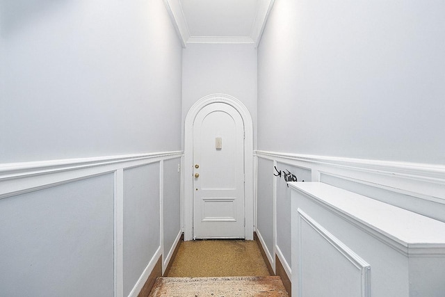 760 W End Ave Unit 1A, New York City, NY 10025 - doorway with crown molding, a decorative wall, and wainscoting