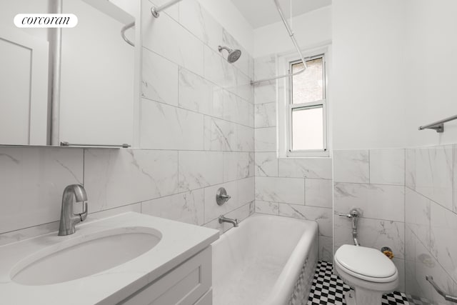 720 W 173rd St Unit 32, New York City, NY 10032 - bathroom featuring tile walls, vanity, toilet, and washtub / shower combination