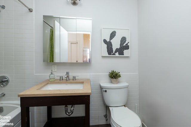 365 Bridge St Unit 23C, New York City, NY 11201 - full bathroom featuring tile walls, toilet, shower / bath combination, and vanity