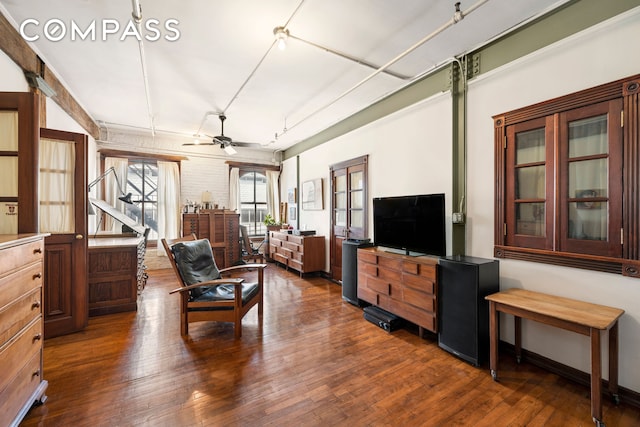 210 Spring St Unit 5, New York City, NY 10012 - living area featuring dark wood-style flooring and a ceiling fan