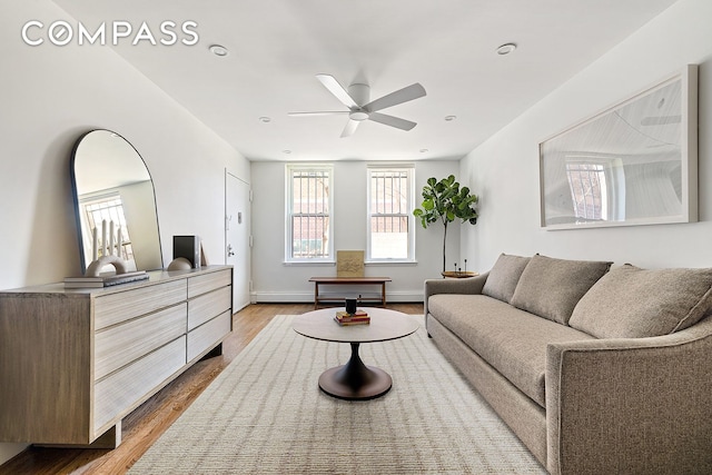 118 Union St Unit 9A, New York City, NY 11231 - living area featuring ceiling fan, wood finished floors, and baseboards