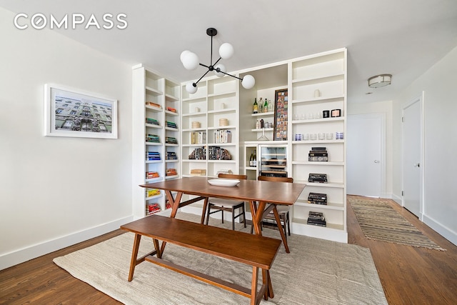 118 Union St Unit 9A, New York City, NY 11231 - dining room featuring baseboards, a chandelier, and wood finished floors