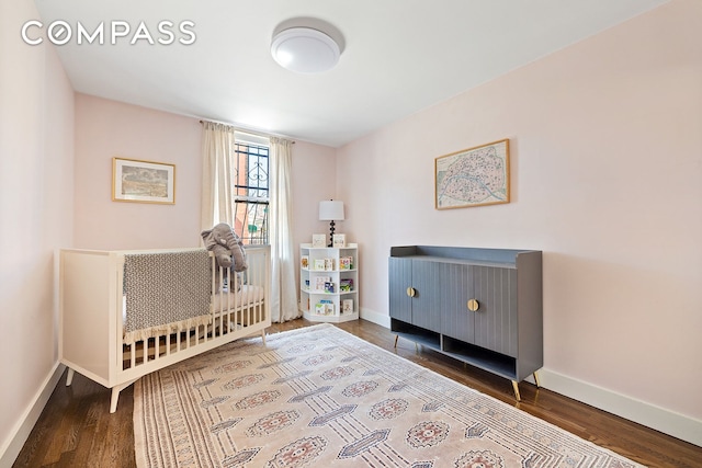 118 Union St Unit 9A, New York City, NY 11231 - bedroom featuring baseboards and wood finished floors