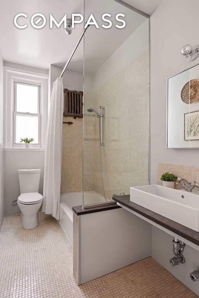 full bathroom with shower / bath combination with curtain, toilet, tile patterned flooring, and a sink