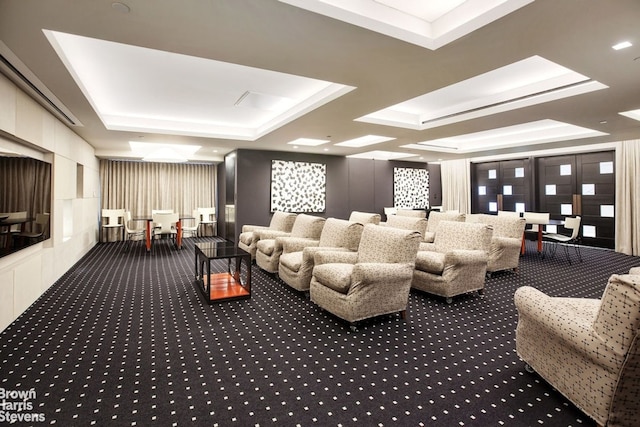 15 W 53rd St Unit 27E, New York City, NY 10019 - carpeted home theater featuring a raised ceiling