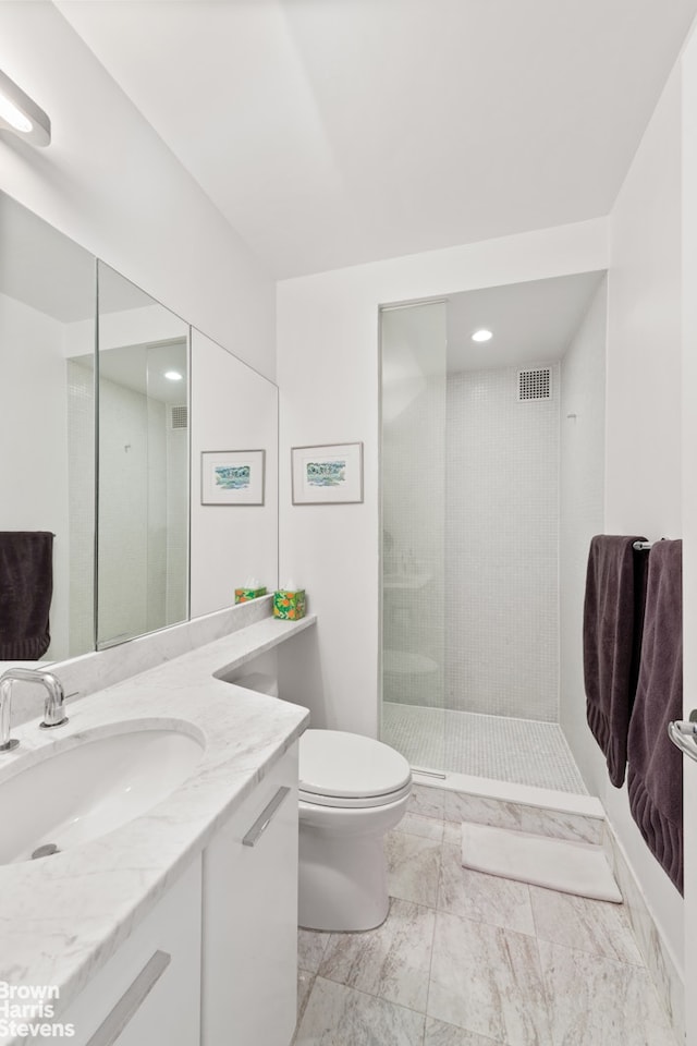2373 Broadway Unit 1610, New York City, NY 10024 - full bathroom featuring vanity, marble finish flooring, toilet, a tile shower, and recessed lighting