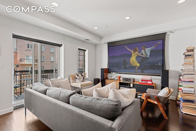 home theater featuring recessed lighting, wood finished floors, and baseboards