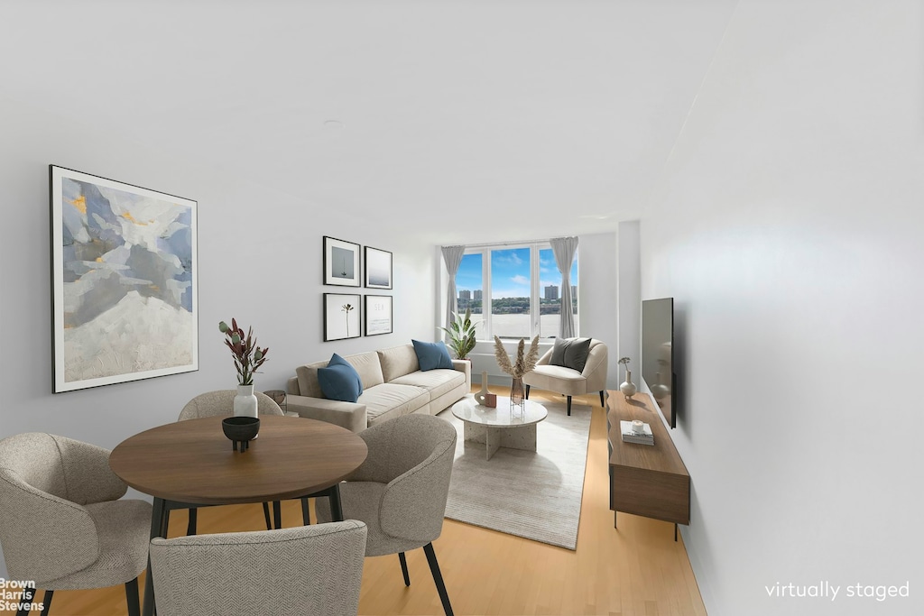 120 Riverside Blvd Unit 7H, New York City, NY 10069 - living room with light wood-style floors and floor to ceiling windows