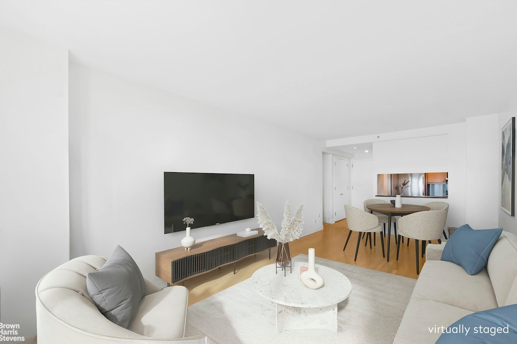 120 Riverside Blvd Unit 7H, New York City, NY 10069 - living room with wood finished floors