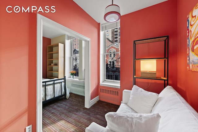 126 W 78th St, New York City, NY 10024 - living area with radiator, baseboards, and dark carpet