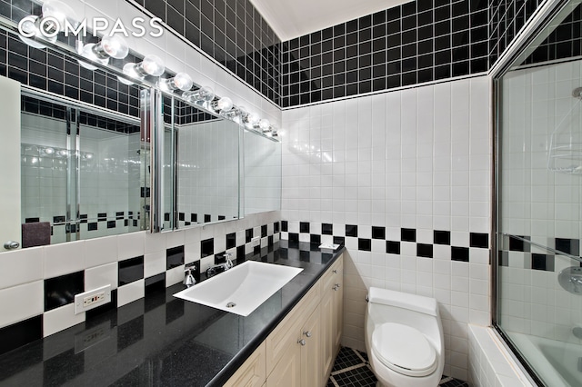 126 W 78th St, New York City, NY 10024 - bathroom with tile walls, combined bath / shower with glass door, and vanity