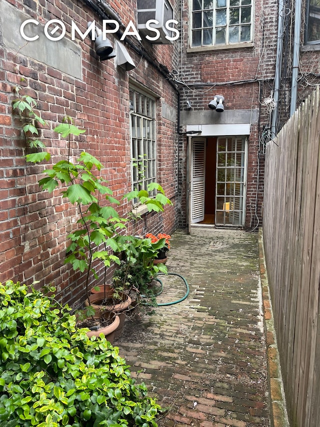 126 W 78th St, New York City, NY 10024 - property entrance featuring brick siding and a deck