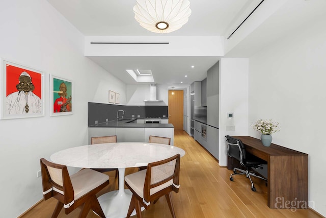 dining area with light wood finished floors