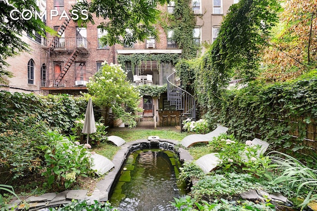 view of yard with a garden pond