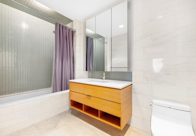 303 E 33rd St Unit 7C, New York City, NY 10016 - full bathroom with tile walls, vanity, tiled shower, toilet, and tile patterned floors