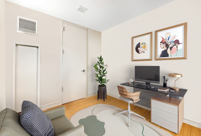 303 E 33rd St Unit 7C, New York City, NY 10016 - home office featuring light wood-type flooring and baseboards