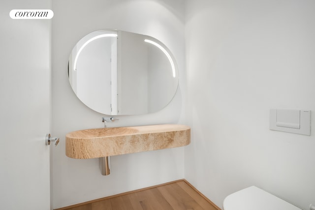56 Leonard St Unit 44Be, New York City, NY 10013 - half bath with toilet and wood finished floors