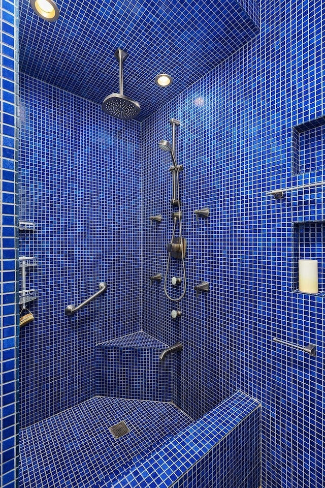bathroom featuring tiled shower