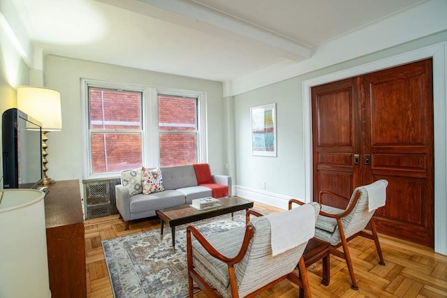 433 W 34th St Unit 5L, New York City, NY 10001 - living area with beamed ceiling, healthy amount of natural light, and baseboards