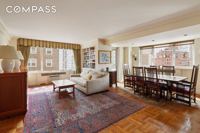 45 E End Ave Unit 10F, New York City, NY 10028 - living room featuring crown molding and a wall mounted air conditioner