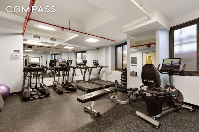 45 E End Ave Unit 10F, New York City, NY 10028 - gym with healthy amount of natural light and baseboards