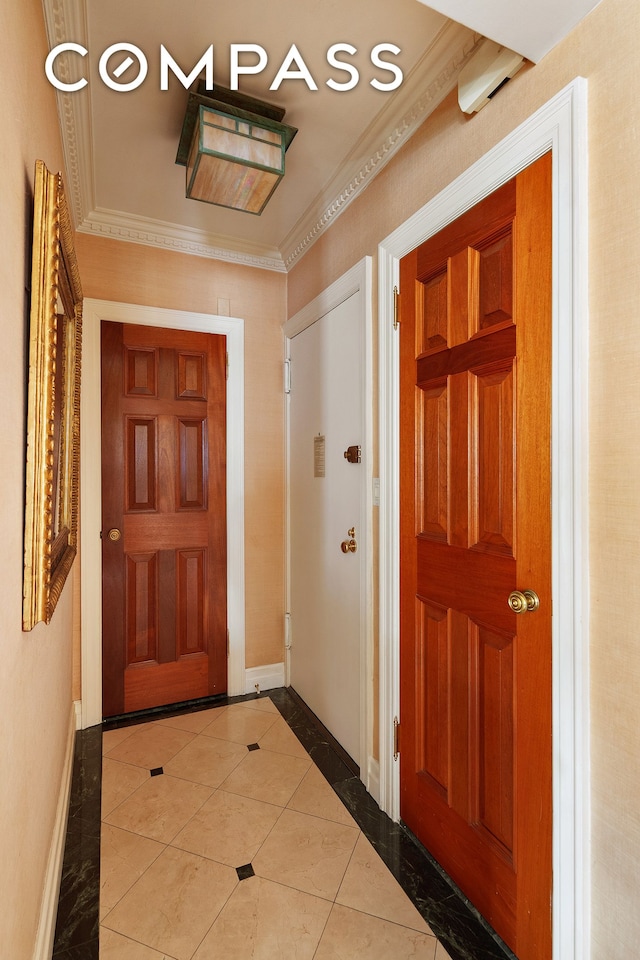 45 E End Ave Unit 10F, New York City, NY 10028 - foyer with baseboards, crown molding, tile patterned flooring, and inlaid floor details