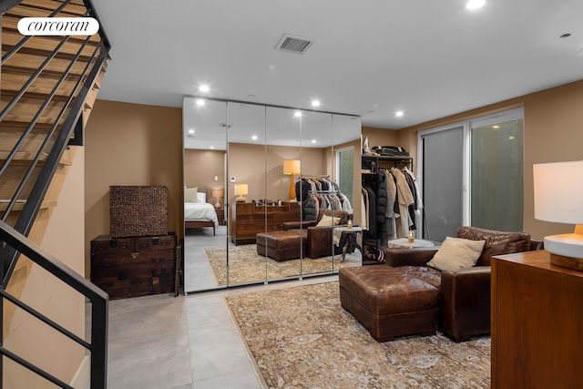 living area featuring light tile patterned floors and recessed lighting