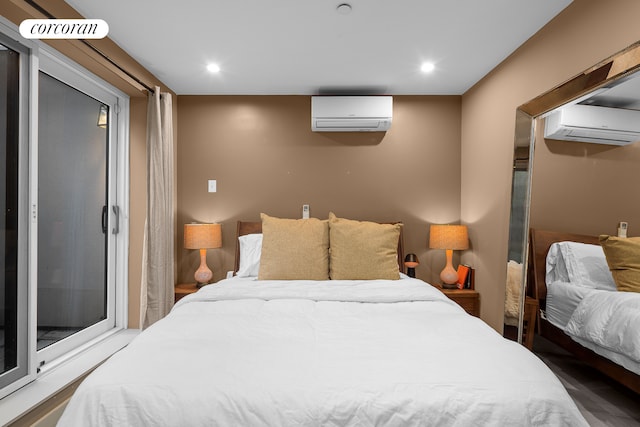 bedroom featuring a wall mounted air conditioner and recessed lighting