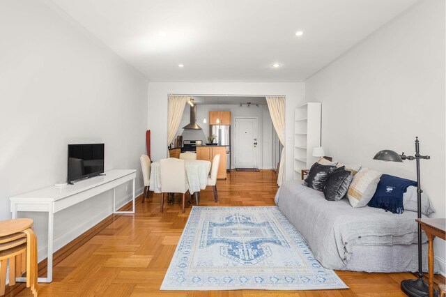 living room featuring recessed lighting and baseboards
