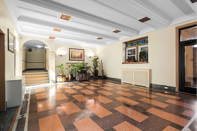 common area with beamed ceiling, crown molding, and stairway