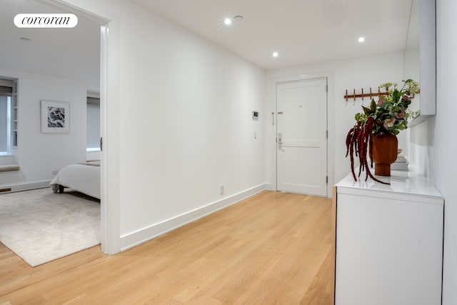 136 E 19th St Unit 1W, New York City, NY 10003 - hall with light wood finished floors, recessed lighting, and baseboards