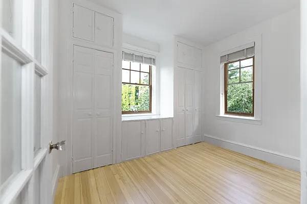 empty room featuring baseboards and light wood-style floors