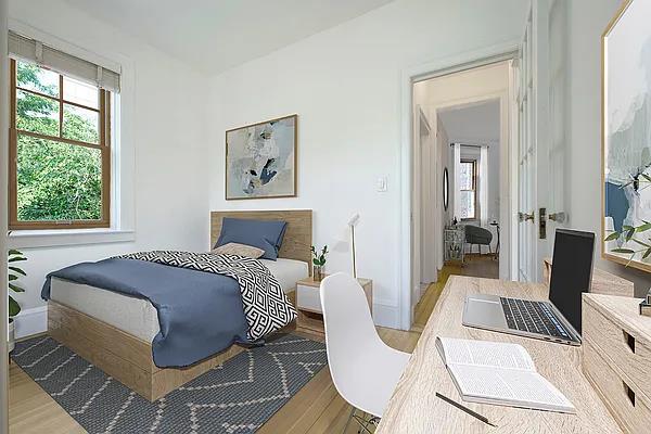 bedroom featuring wood finished floors and baseboards