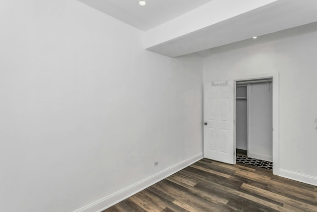 67-25 Clyde St Unit 1G, New York City, NY 11375 - unfurnished bedroom featuring recessed lighting, baseboards, a closet, and dark wood-type flooring