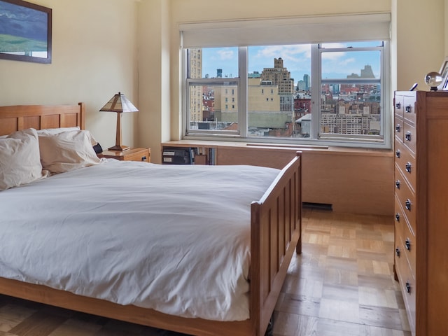 bedroom featuring a city view